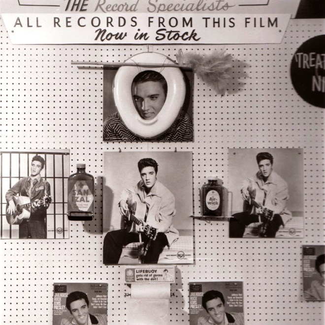 Early window display. Poor opinion of Elvis Presley expressed.