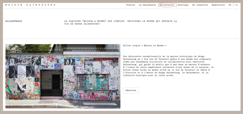 Exterior view of Serge Gainsbourg's house, which has been converted into a museum, featuring a graffiti-covered wall and an entrance door.